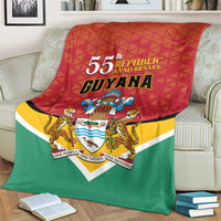 Guyana republic anniversary blanket with large 55th lettering, crest, and red-yellow-green border