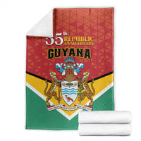 Folded Guyana republic anniversary blanket with 55th text, crest, and red-yellow-green shield