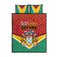 Flag-style Guyana quilt and two pillows, green yellow white red 55th anniversary front