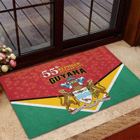 Green rubber doormat with Guyana 55th Republic Anniversary flag emblem near door