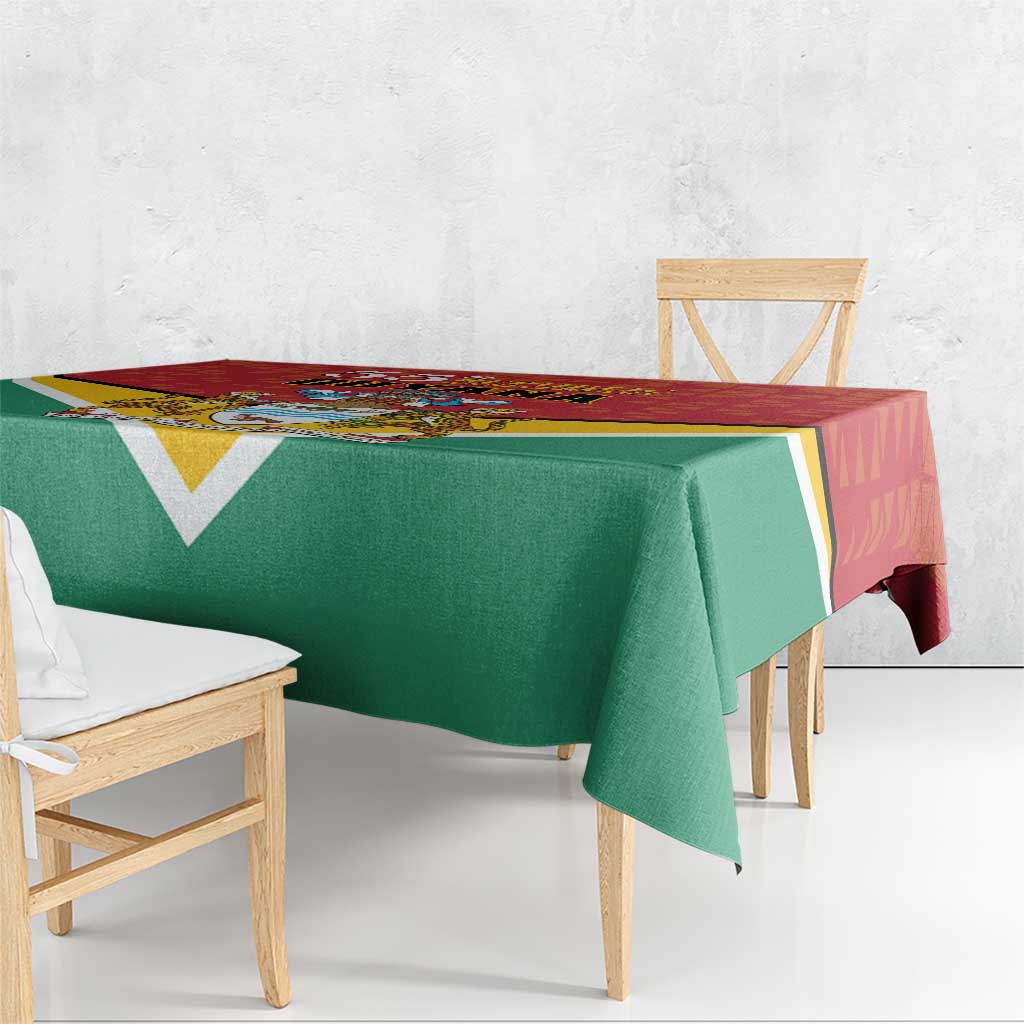Guyana flag style tablecloth on wooden bench, green center with red top edge