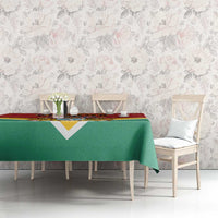Guyana flag style tablecloth on dining table with green drape and red strip top