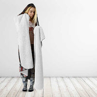 Hooded blanket with sherpa-lined sleeves and white fleece hood lining