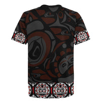 Black rugby jersey with camo pattern and Haida-style totem and emblem panel at hem