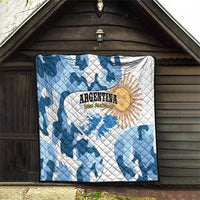 Blue and white camo quilt with sun emblem and Argentina text hanging in a barn