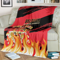 Belgium football blanket folded on couch with BELGIUM logo and flame artwork