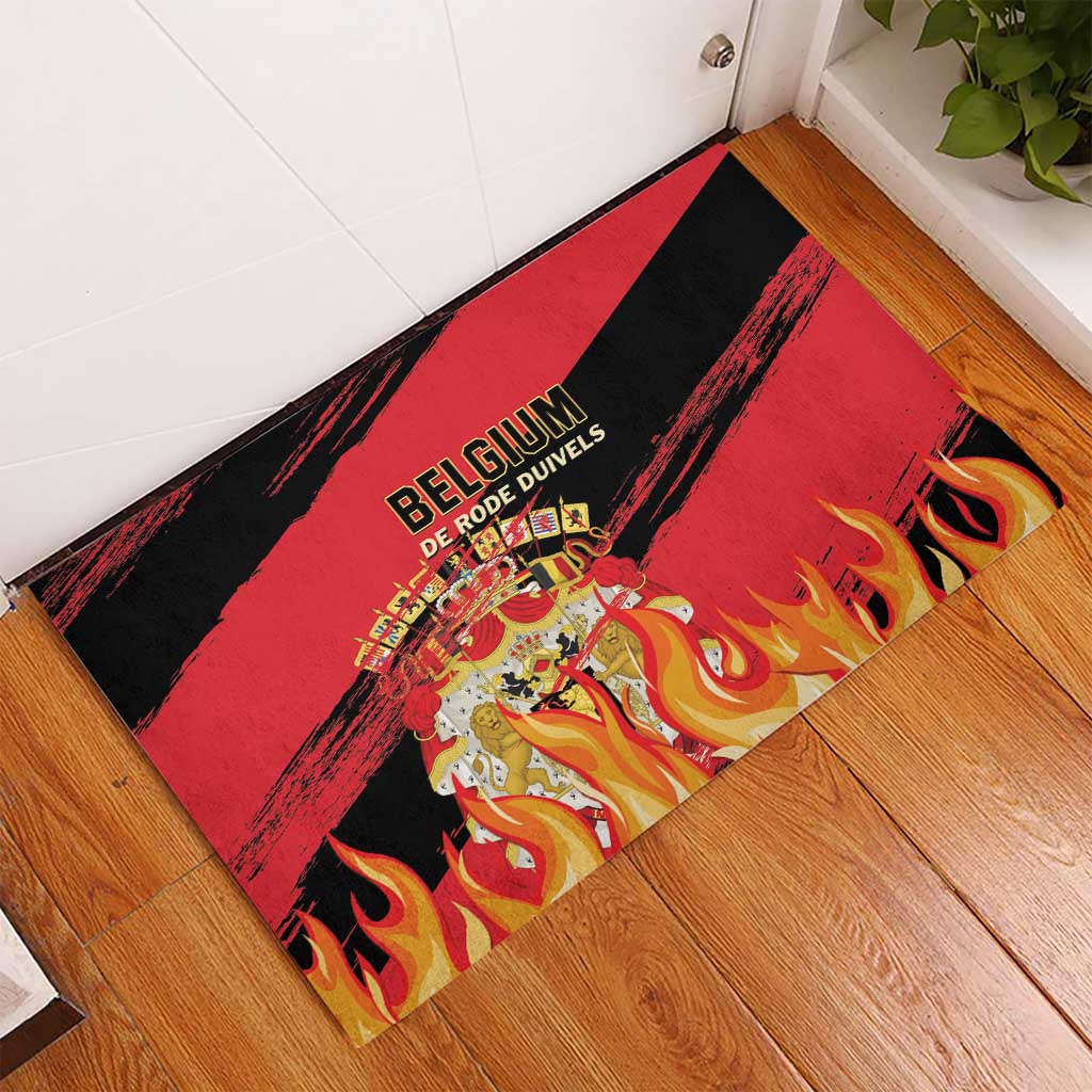 Belgium football rubber doormat on floor, black red stripes with flames and crest