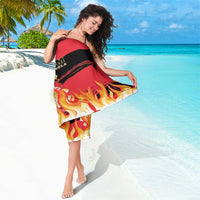 Red and black football sarong with flame design, draped across shoulders