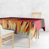 Flame-themed football tablecloth with red, black, and yellow artwork along the edge