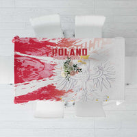 Red and white football-themed tablecloth with graphic crest and floral center