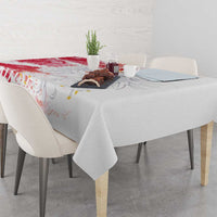 Red and white tablecloth covering a dining table with visible football graphic pattern