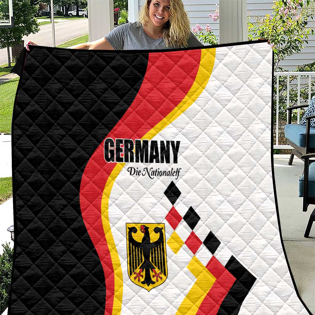 Quilt close-up with Germany wordmark, quilted flag graphic in black, white, red, and yellow