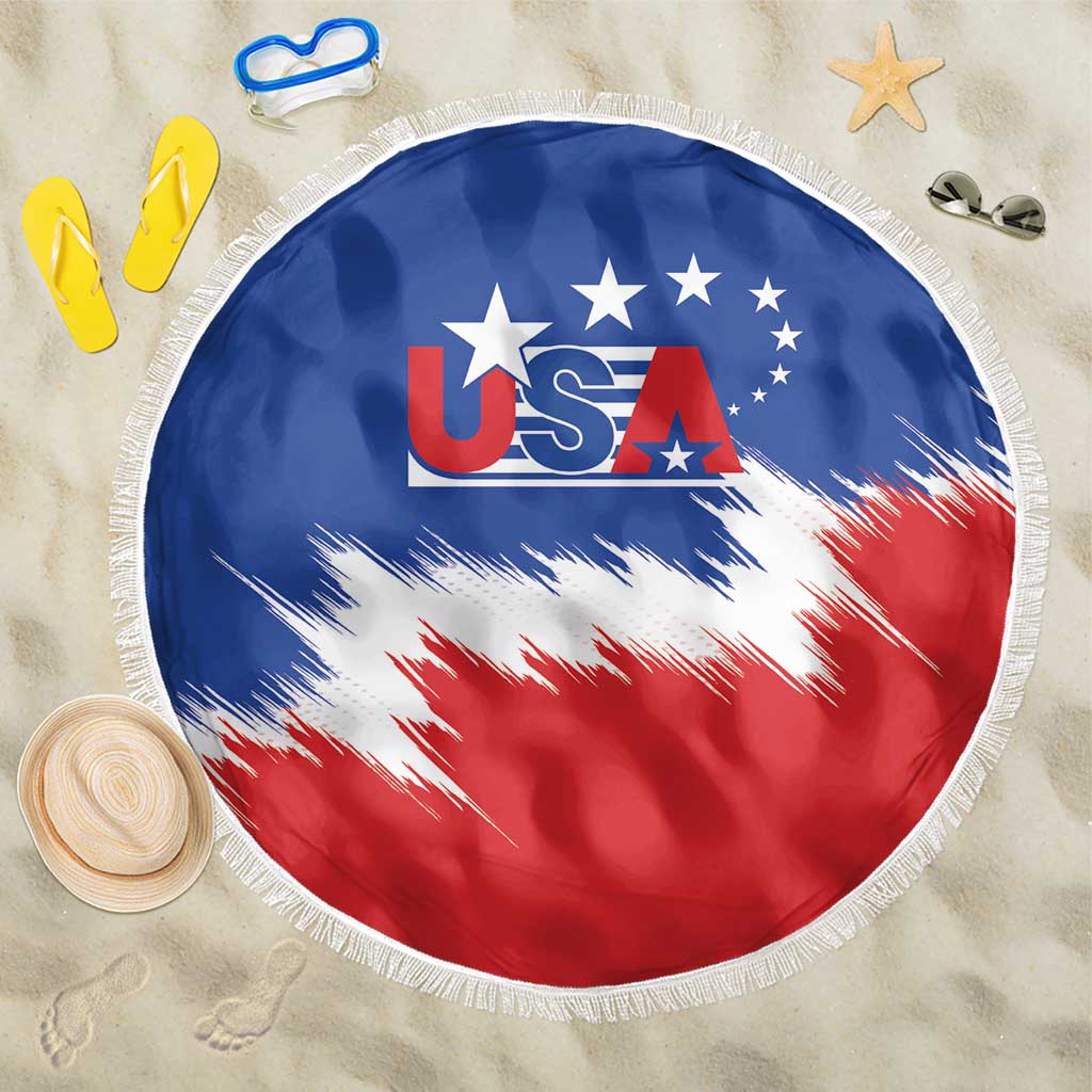 Round beach blanket with USA logo in center, blue and red, white fringe border