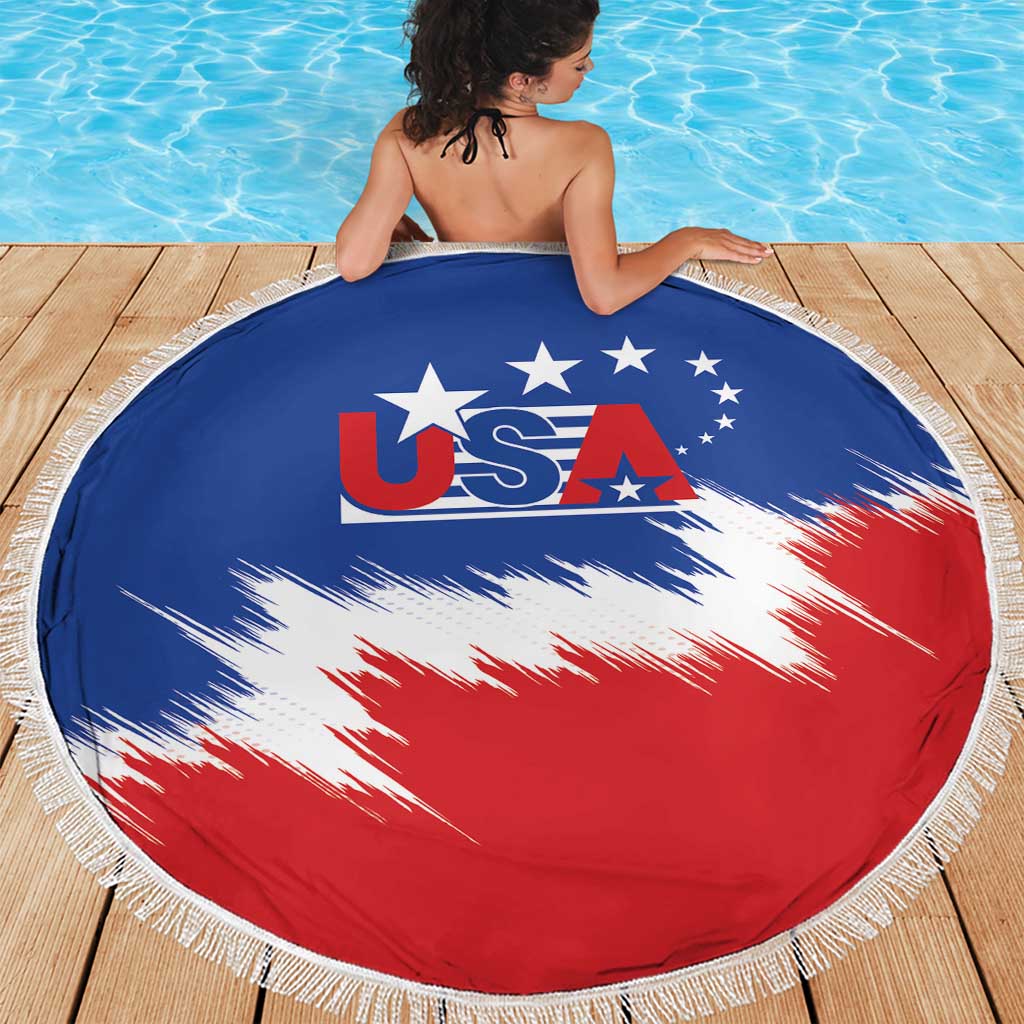 Round beach blanket with USA logo, blue and red center, white fringe trim