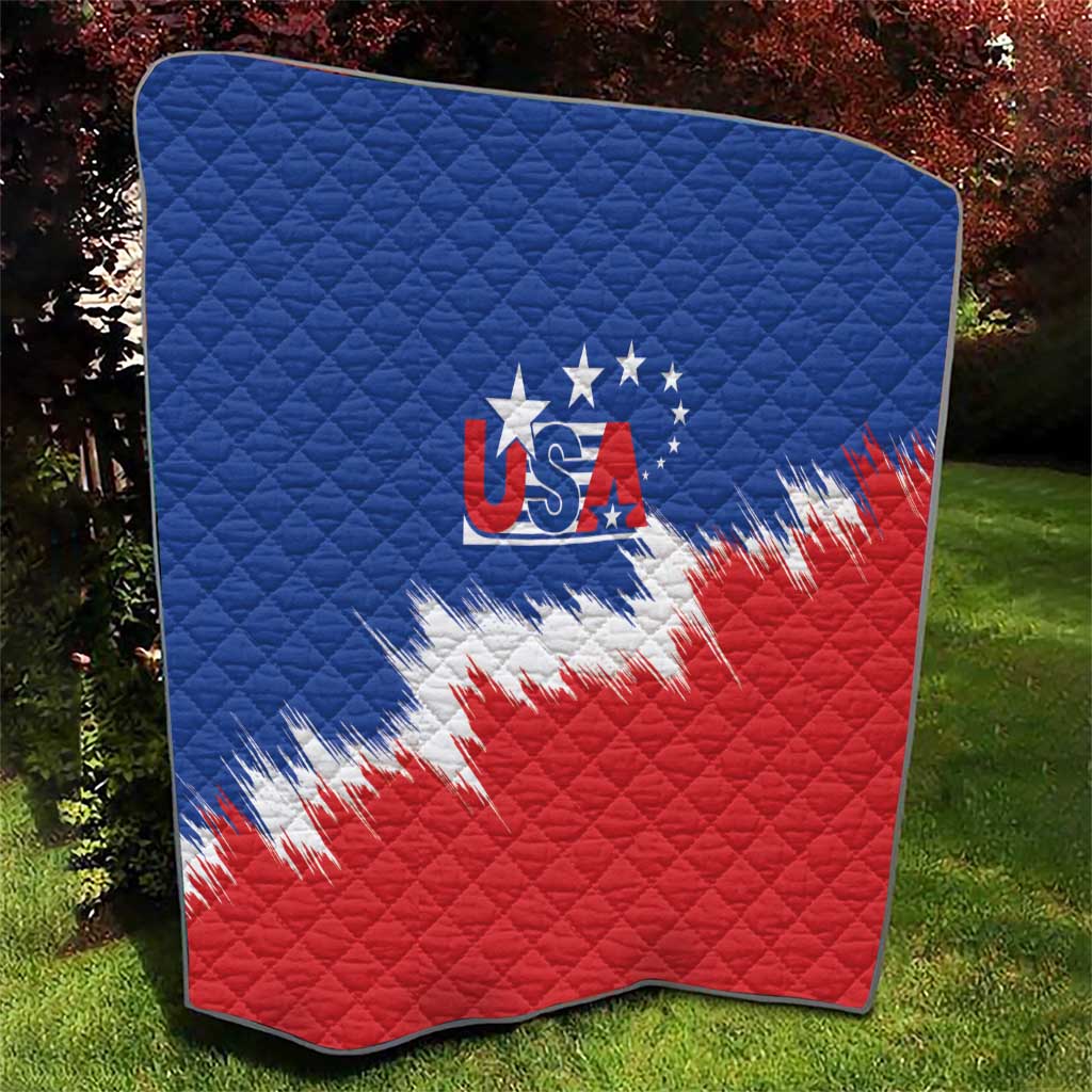 Blue and red quilt featuring USA flag emblem with white brush-stroke accents