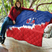 USA flag quilt draped on outdoor seating, blue top and red bottom with diamond stitching