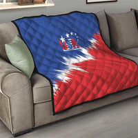 USA flag quilt with diamond stitching draped over a gray sofa