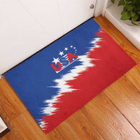 Blue rubber USA doormat on floor with red and white splash flag design