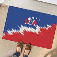 Blue rubber USA doormat with red and white splash flag, shown on entry floor