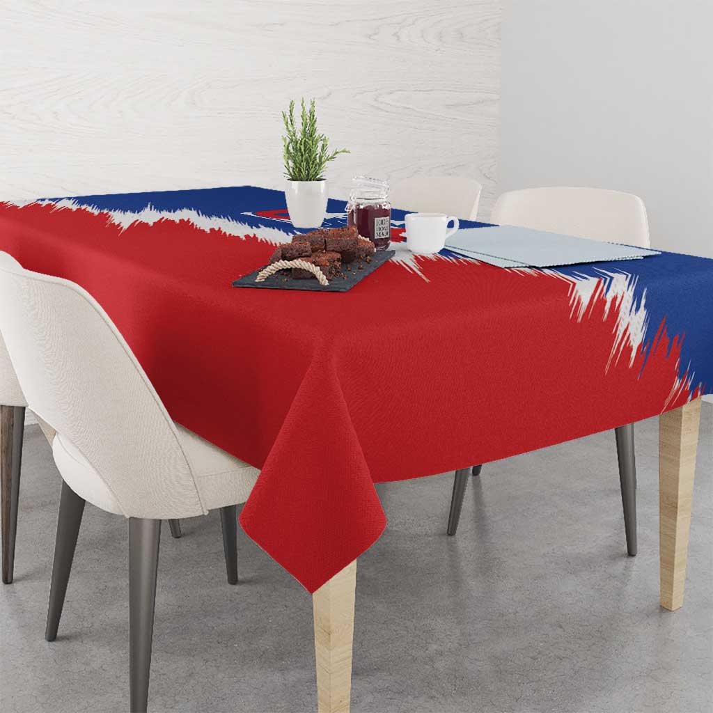Red and blue USA tablecloth with white brush-stroke stripes, on dining table.