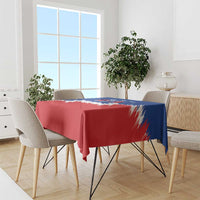 Red tablecloth with blue corner panel and white brush stripes, USA-themed for dining.