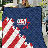 Blue quilt blanket showing USA logo, stars, and red-and-white stripe design with diamond quilting