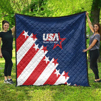 Blue USA quilt blanket with stars and red-and-white stripe flag pattern, held outdoors on grass