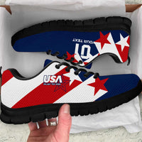 Colorful soccer sneakers with blue, white, red star graphics and black rubber sole.