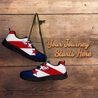 Low-top soccer sneakers in white and blue with red star print and black sole.