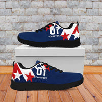 Blue and white low-top soccer sneakers with red stars and black rubber sole.