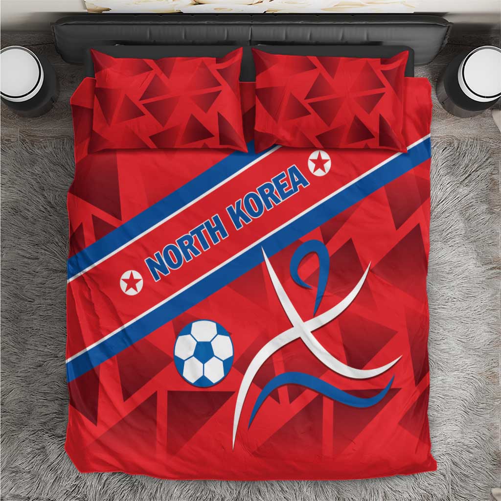 Red bedding set with North Korea text, soccer ball, and ribbon-style emblem, two pillows