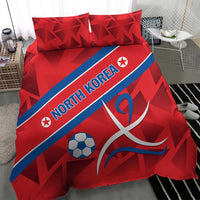 Red bedding set featuring North Korea text, soccer ball, and ribbon emblem, two matching pillows