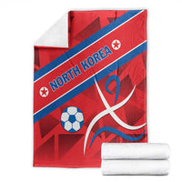Red North Korea football blanket with blue stripe, North Korea text, soccer ball and emblem