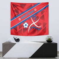 Red North Korea football tapestry with blue band, soccer ball, and swirling ribbon mark