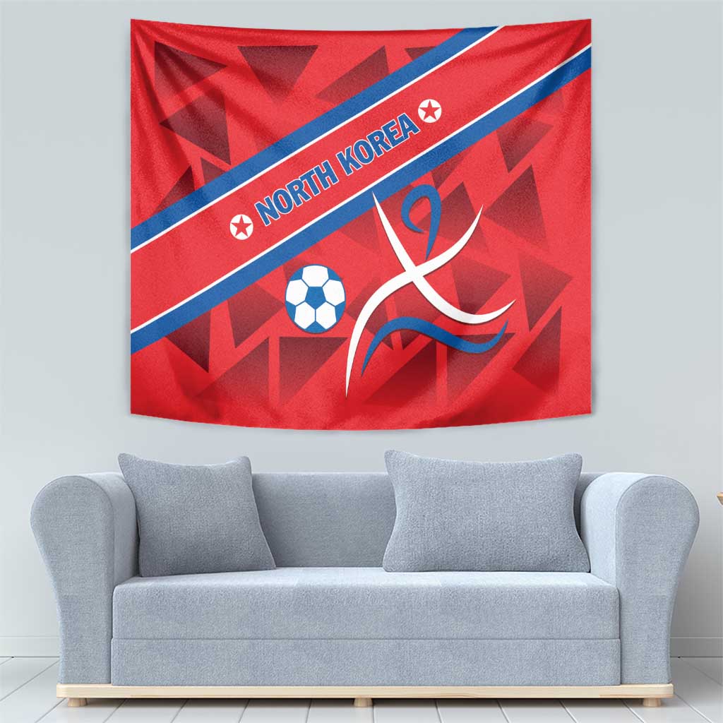 Red North Korea football tapestry with blue diagonal stripe, soccer ball, and flame-like design