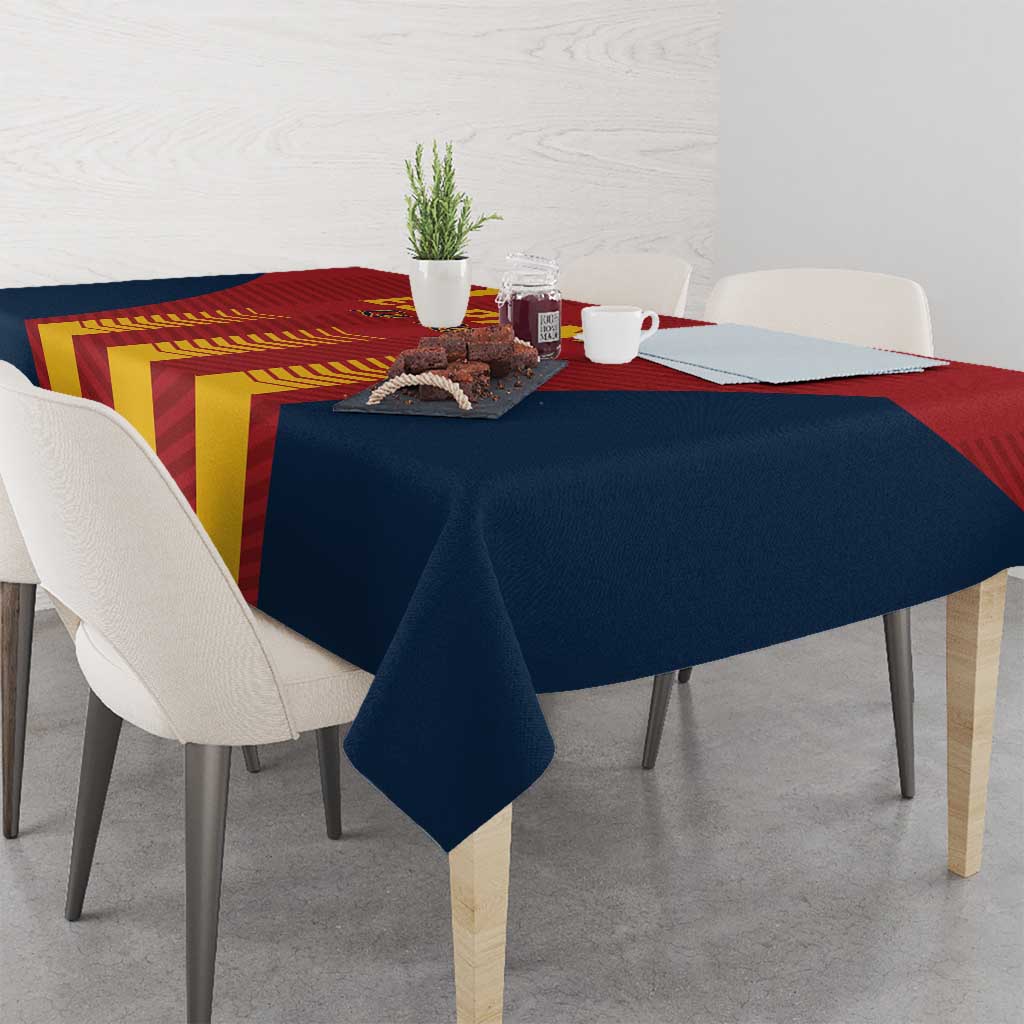 Spain football tablecloth in navy and red with yellow stripe graphic, covers dining table.