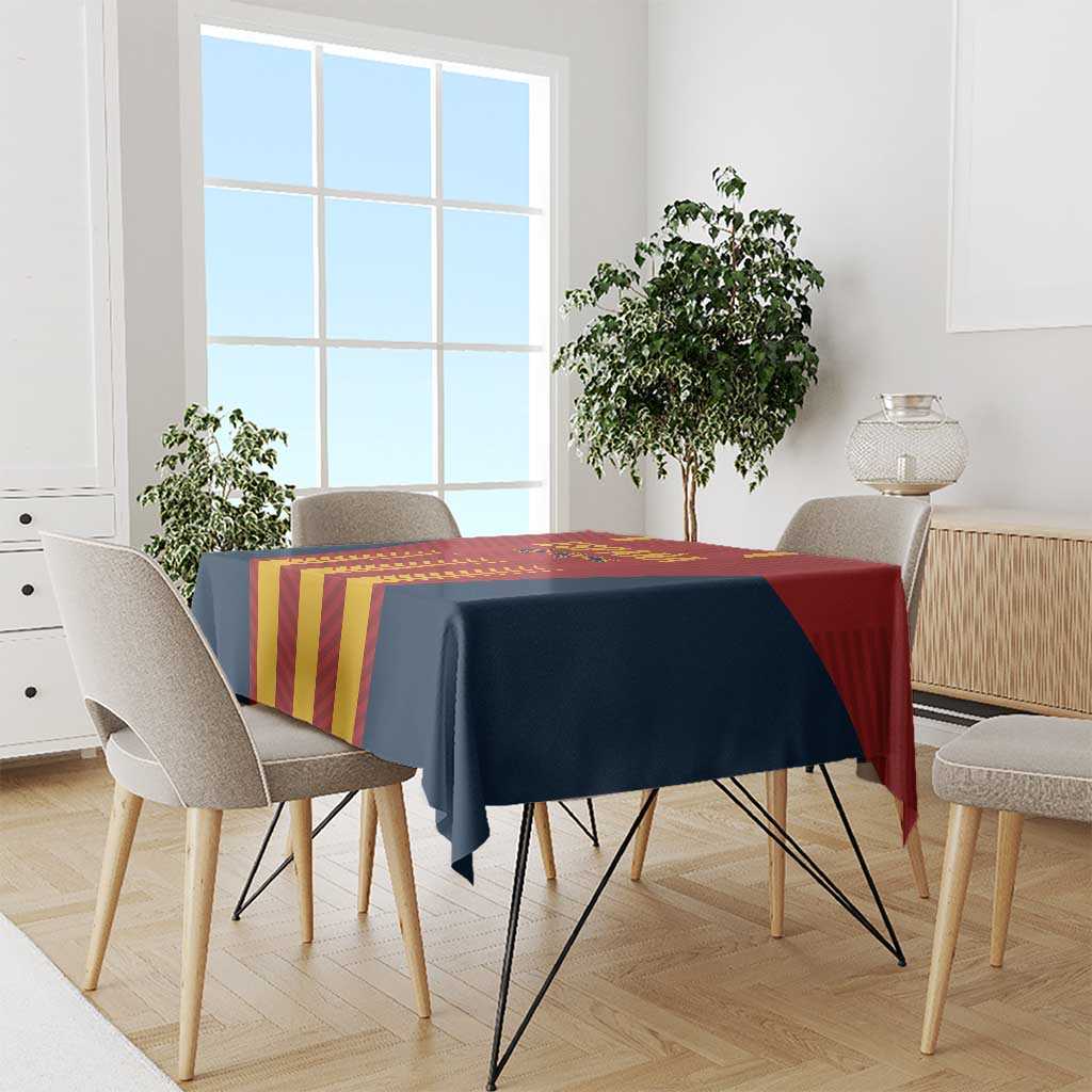 Spain football tablecloth with navy, red, and yellow vertical stripes on dining table.