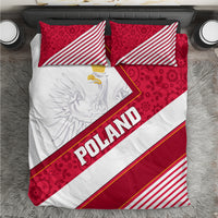 Poland bedding set: red patterned pillows, white duvet with diagonal eagle and 'POLAND' stripe