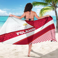 Poland flag sarong draped on beach, red floral top, white eagle panel, POLAND text