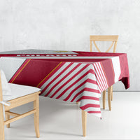 Red, white, and gold-striped tablecloth with diagonal banner design