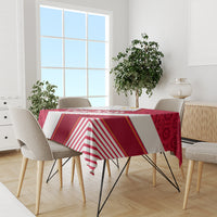 Red and white patterned tablecloth on dining table