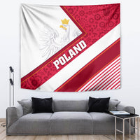 Grey sofa backdrop with Polish tapestry showing white eagle, “POLAND” text, red stripes