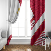 White window curtain with red side panel and diagonal stripe design at a bright window