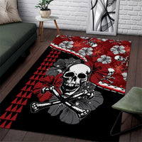 Red and black area rug with skull, hibiscus flowers, and geometric triangle pattern