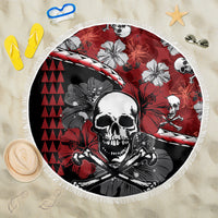 Round beach blanket with red hibiscus skull and crossbones graphic, white fringe edge