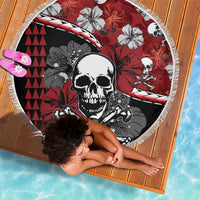 Round beach blanket with skull and hibiscus pattern, red and black tones, white fringe