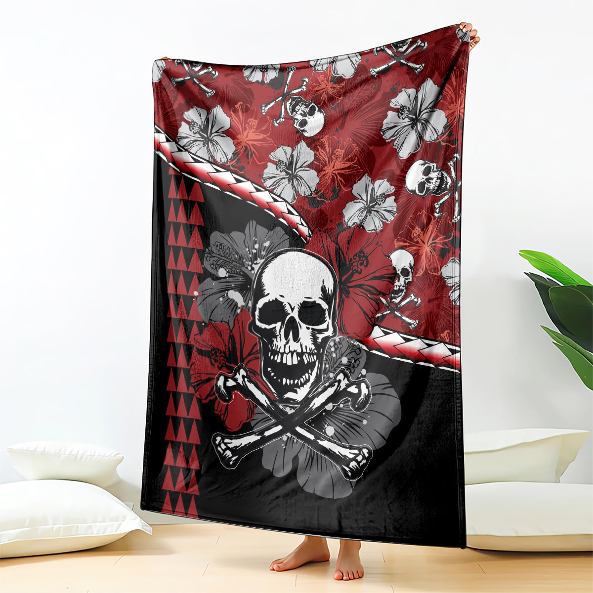 Red skull Halloween blanket with crossbones, hibiscus flowers, and tiki triangle pattern
