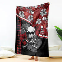 Red skull Halloween blanket with crossbones, hibiscus flowers, and tiki triangle pattern