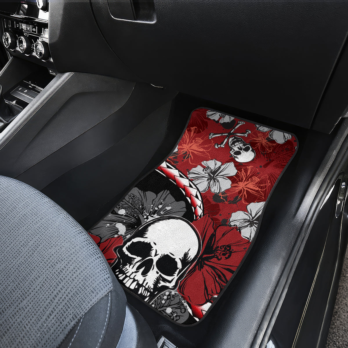 Red car floor mat with hibiscus flowers, skull face, and crossbones pattern