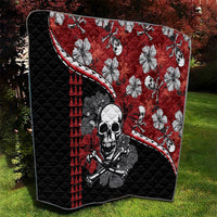 Red and black quilt with skull centerpiece, hibiscus hibiscus-style flowers, red triangle panels